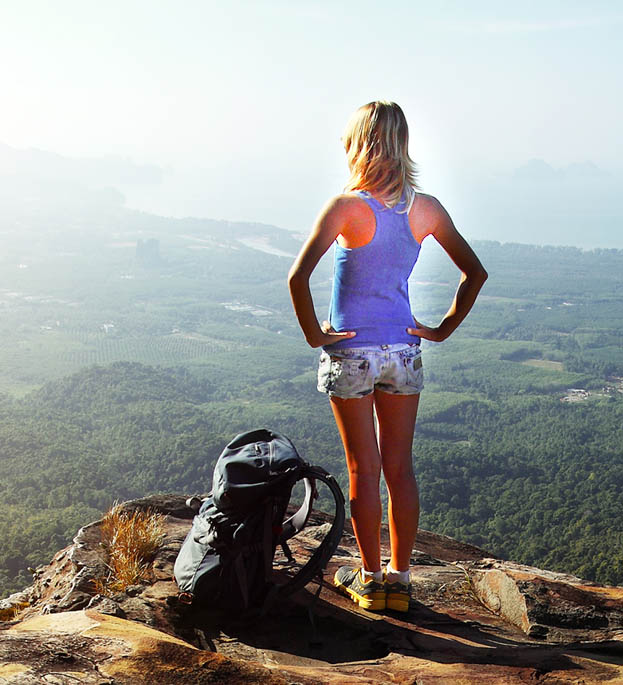 Woman hiker on a mountain top